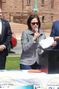 Photo of WNYCOSH director speaking at a Worker's Memorial Day event